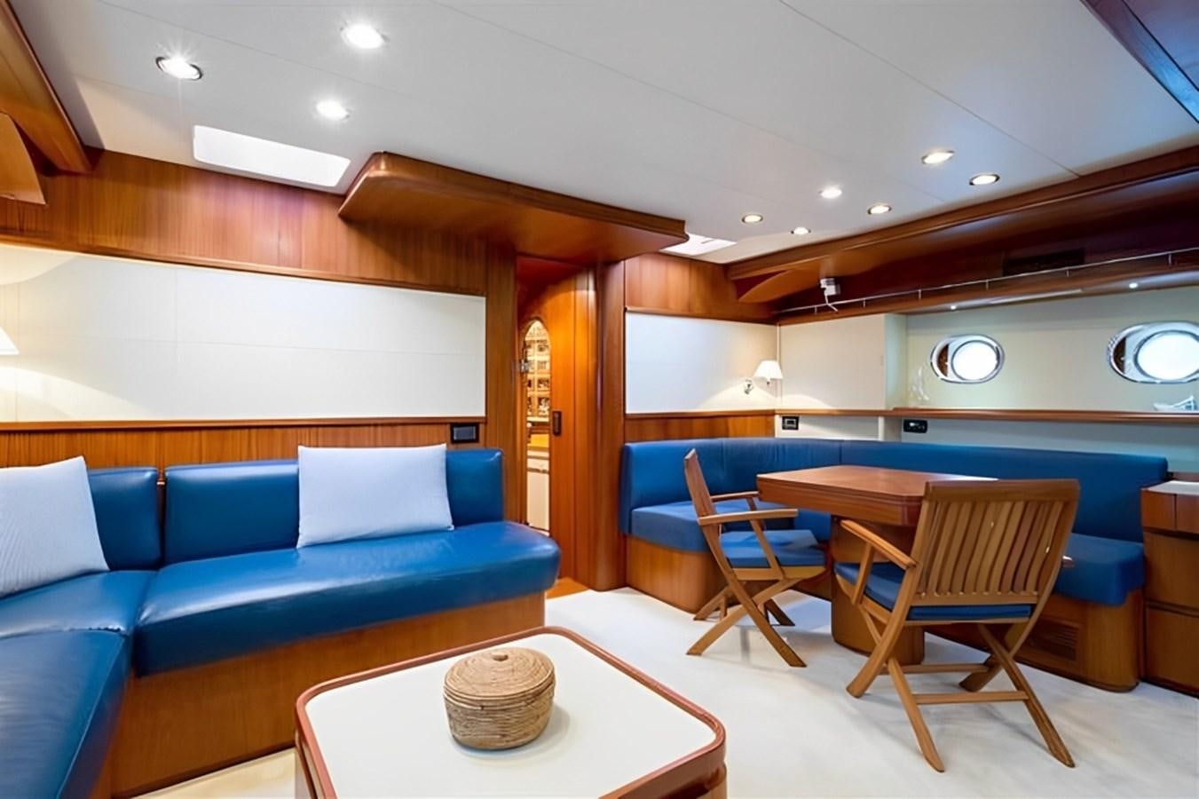 a room with a couch and a table aboard ELETTRA Yacht for Sale