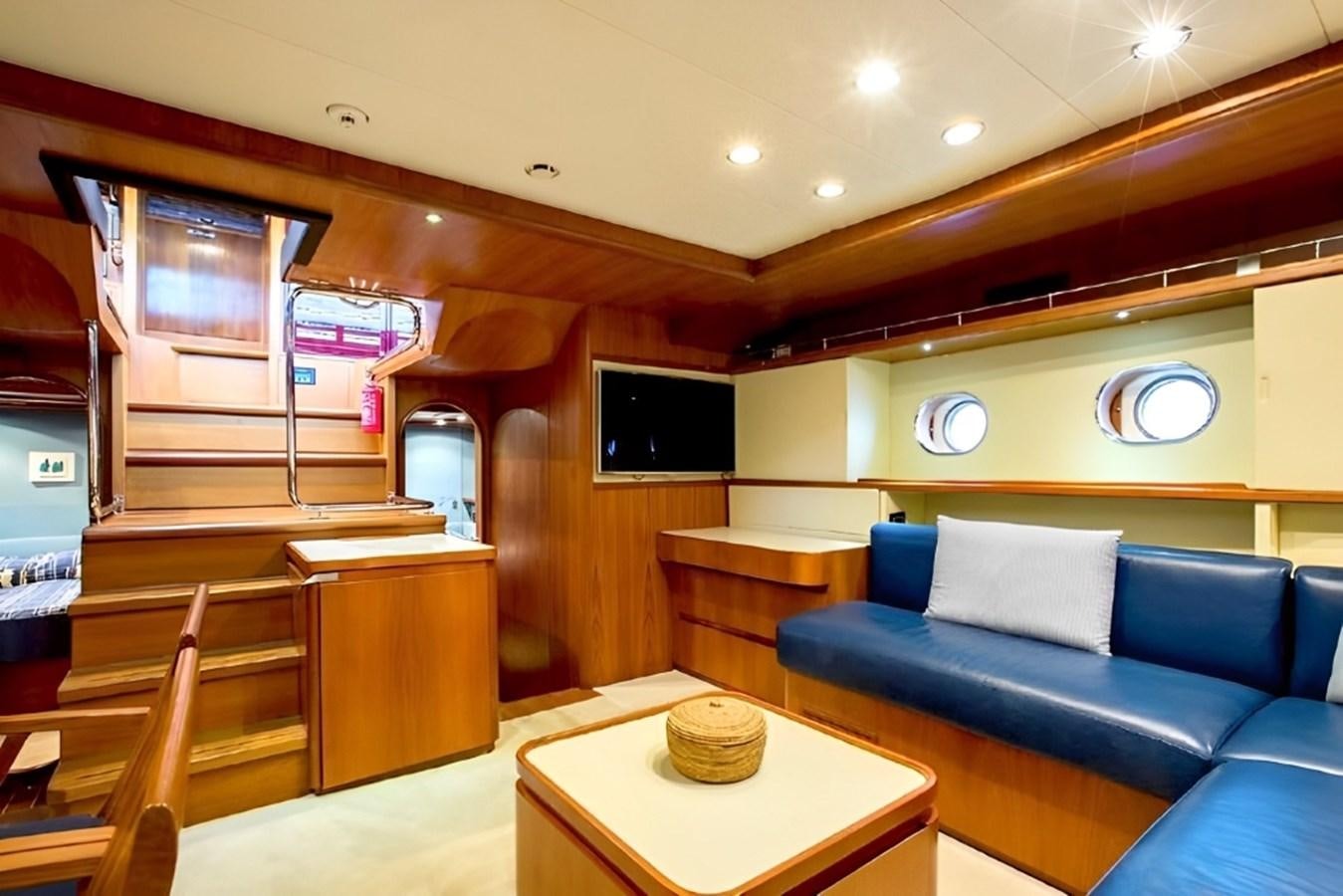 a room with a couch and a table aboard ELETTRA Yacht for Sale