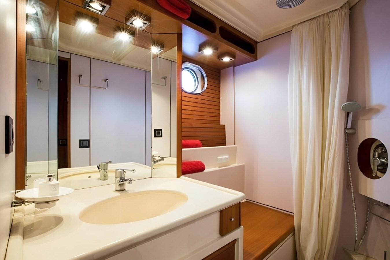 a bathroom with a sink and a mirror aboard ELETTRA Yacht for Sale