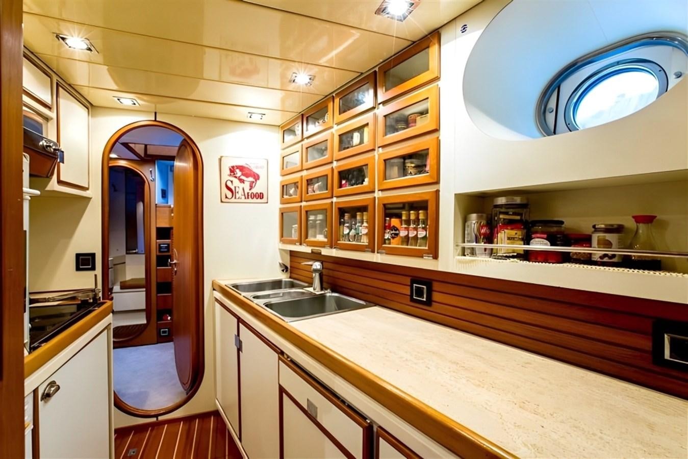 a kitchen with a large island aboard ELETTRA Yacht for Sale