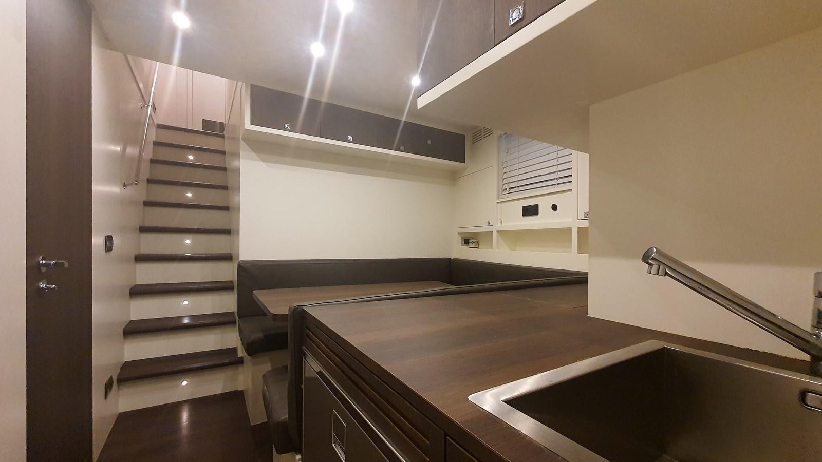 a kitchen with a large island aboard M32 025 Yacht for Sale