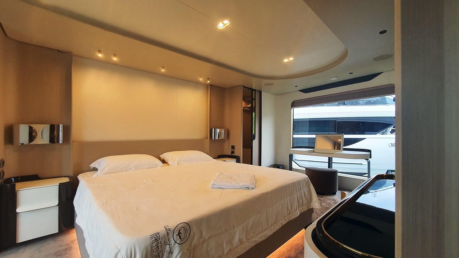 a bedroom with a large bed aboard M32 025 Yacht for Sale