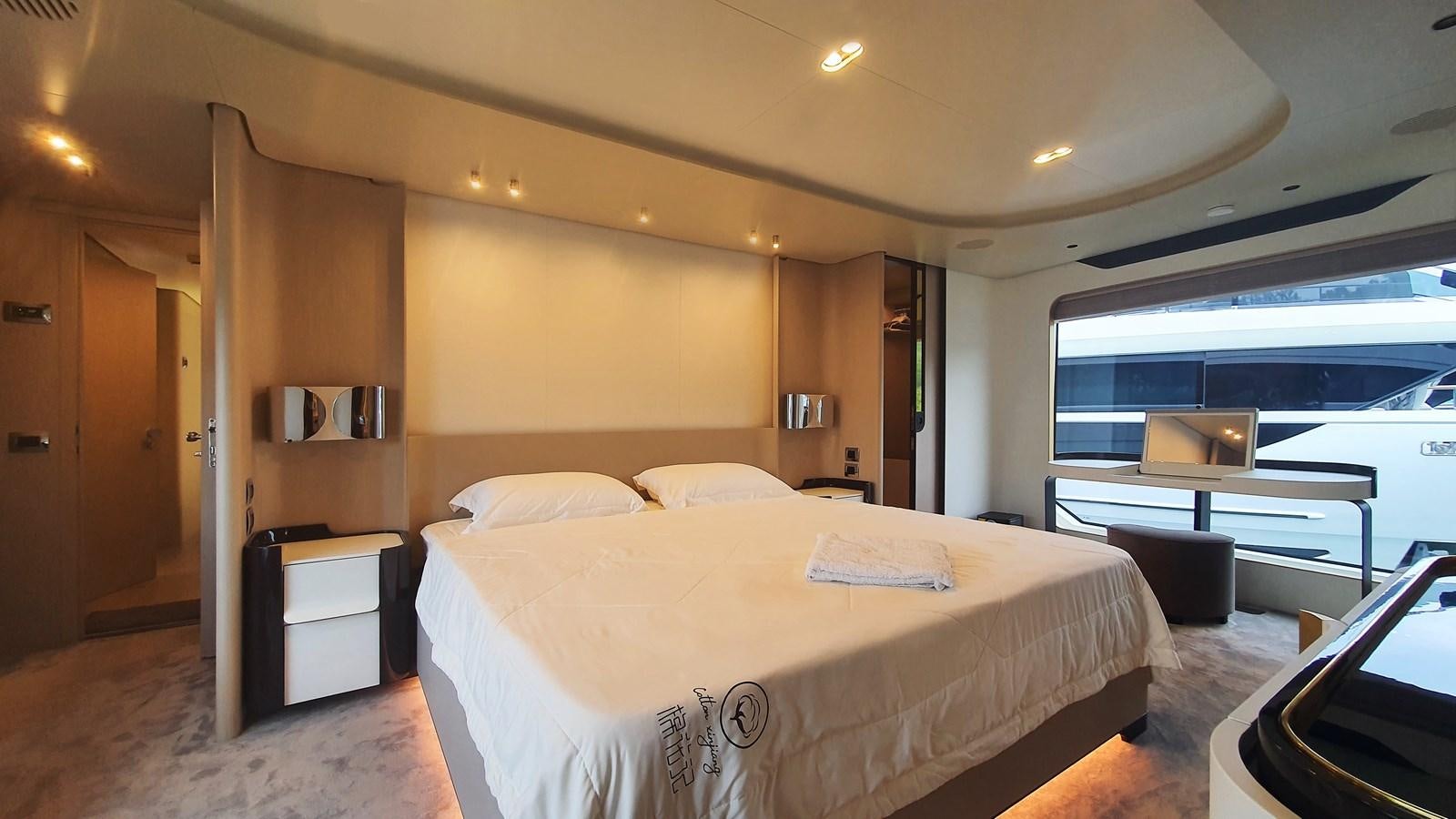 a hotel room with a bed and a desk aboard M32 025 Yacht for Sale