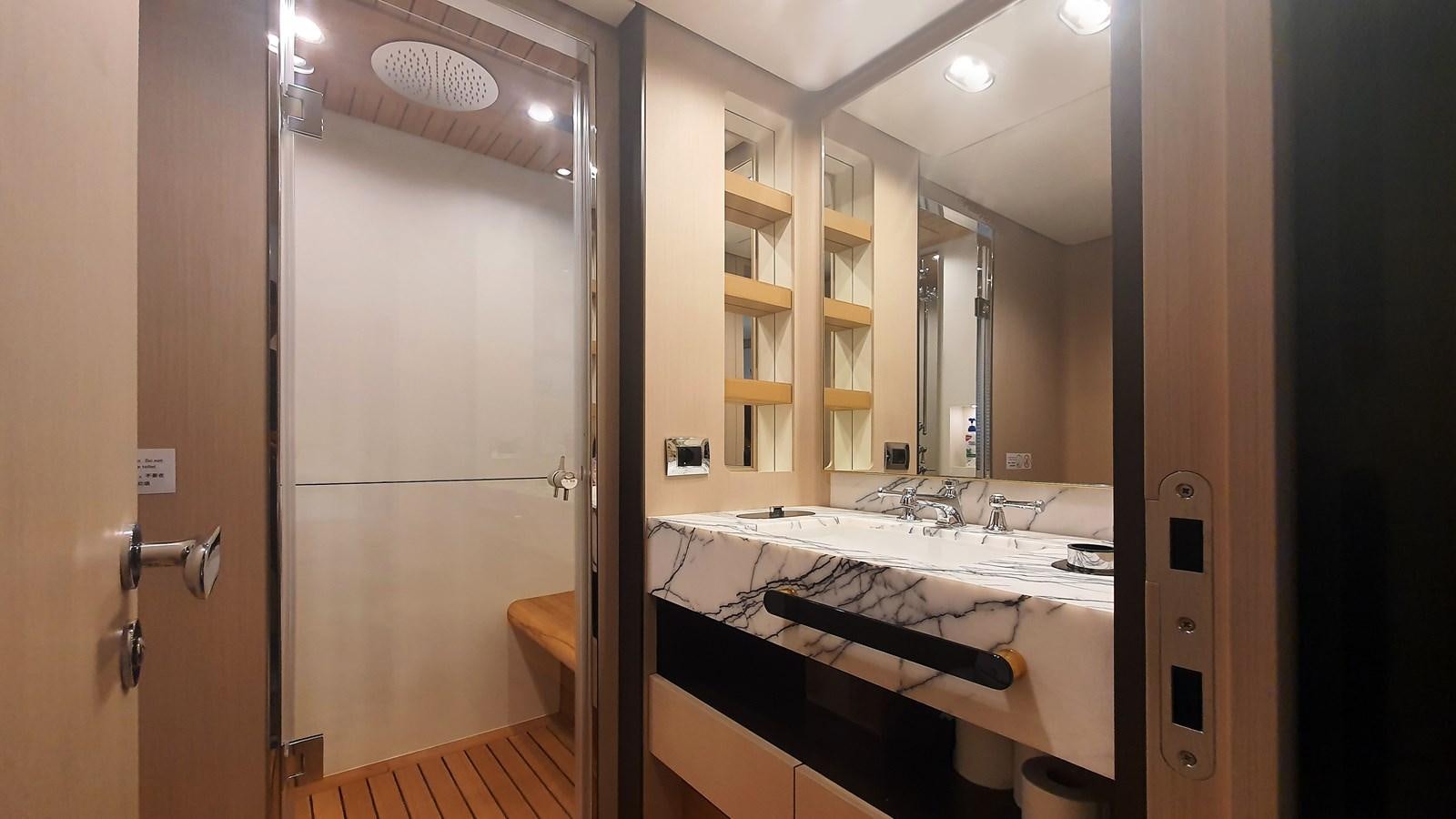a bathroom with a large mirror aboard M32 025 Yacht for Sale