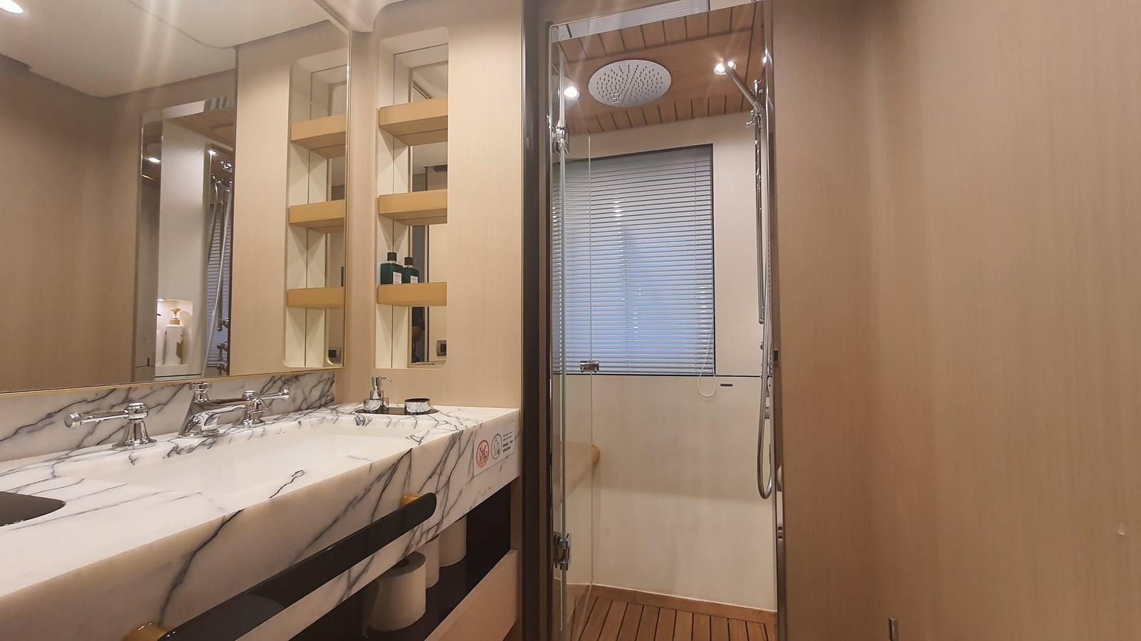 a bathroom with a bathtub and sink aboard M32 025 Yacht for Sale