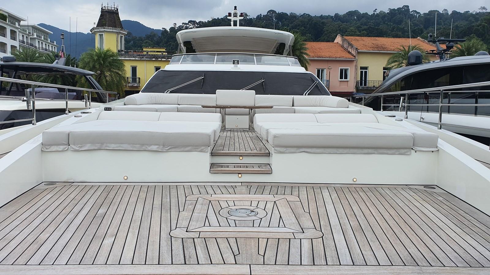 a white boat on a deck aboard M32 025 Yacht for Sale