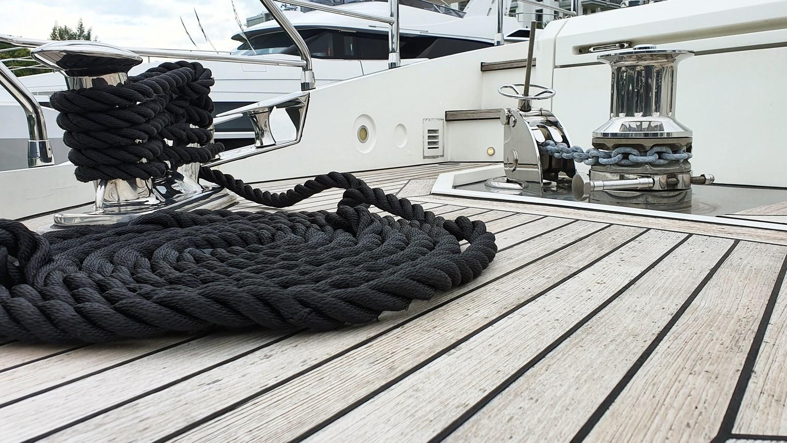 a pile of wood on a deck aboard M32 025 Yacht for Sale