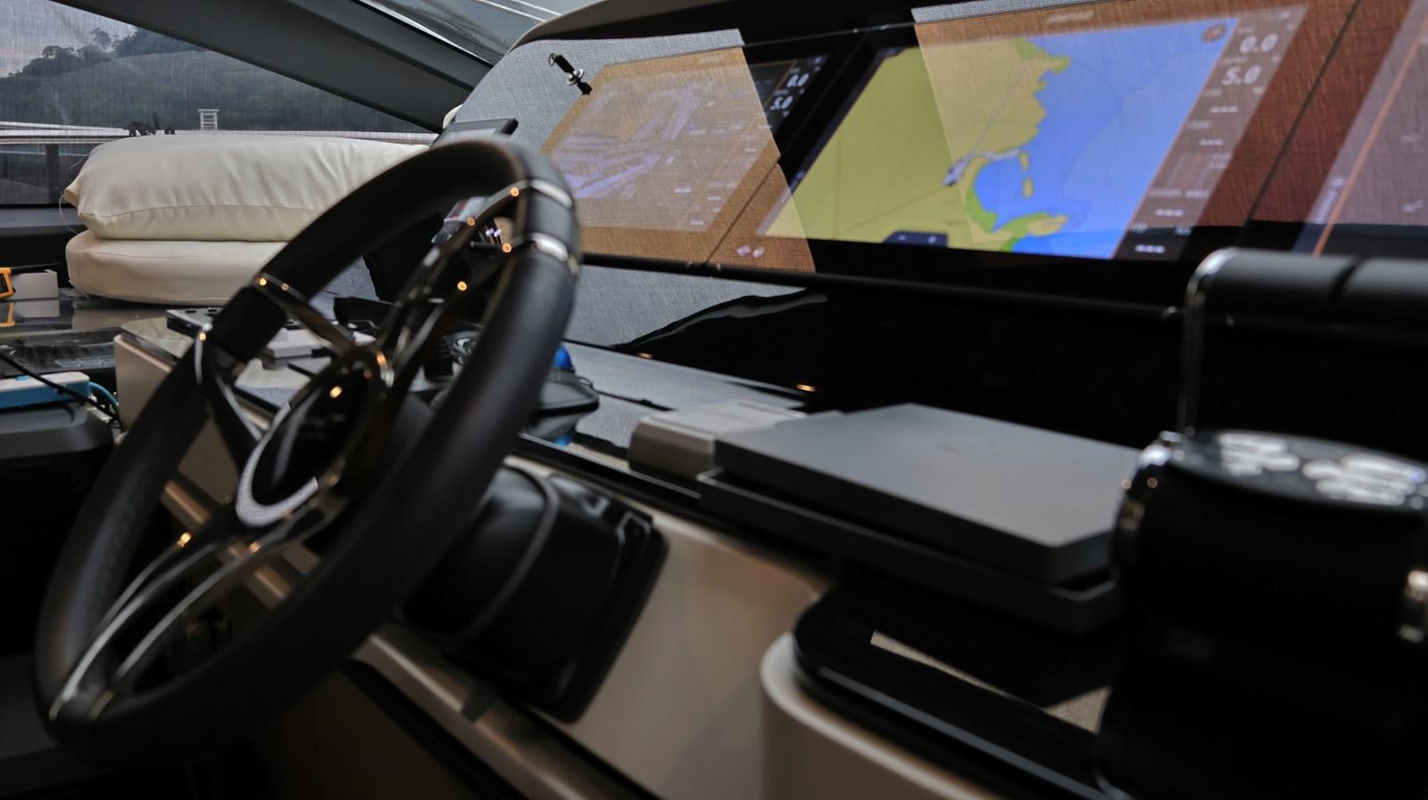 a black and silver steering wheel aboard M32 025 Yacht for Sale