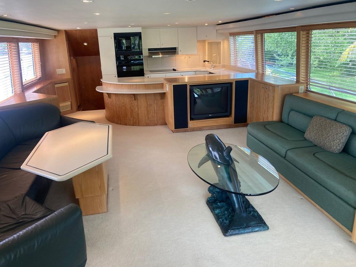 a living room with a couch and a television aboard LADY JANE Yacht for Sale
