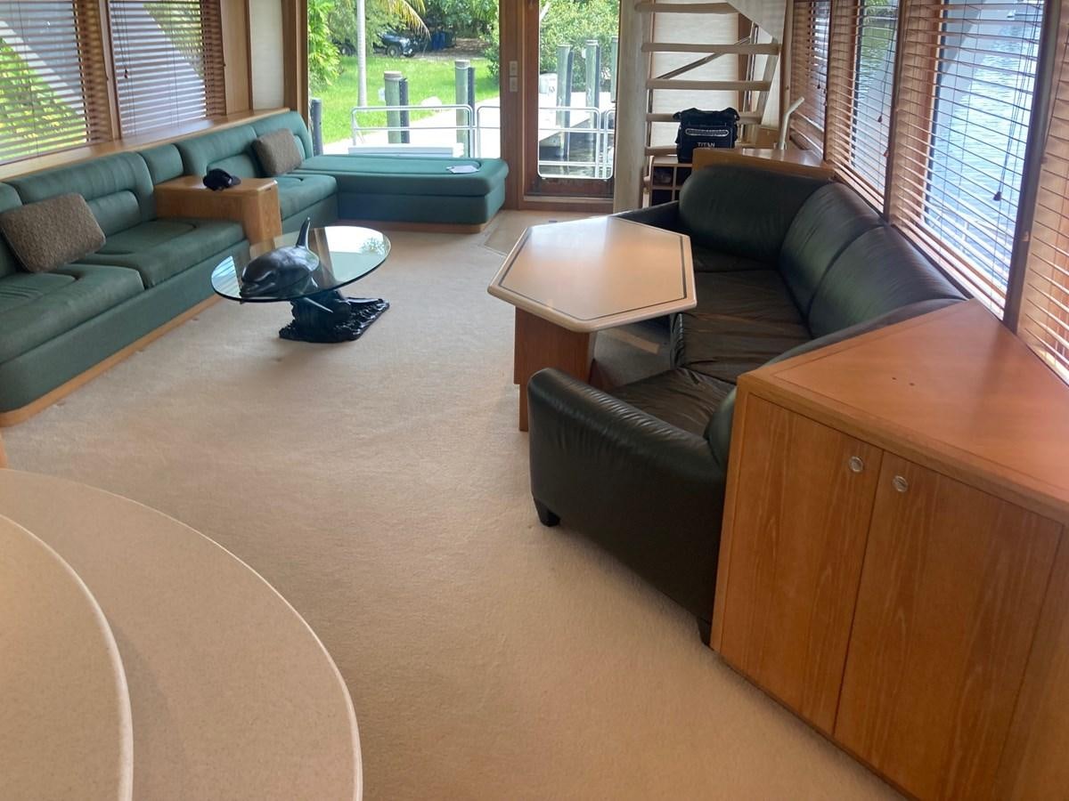 a living room with a couch and a coffee table aboard LADY JANE Yacht for Sale