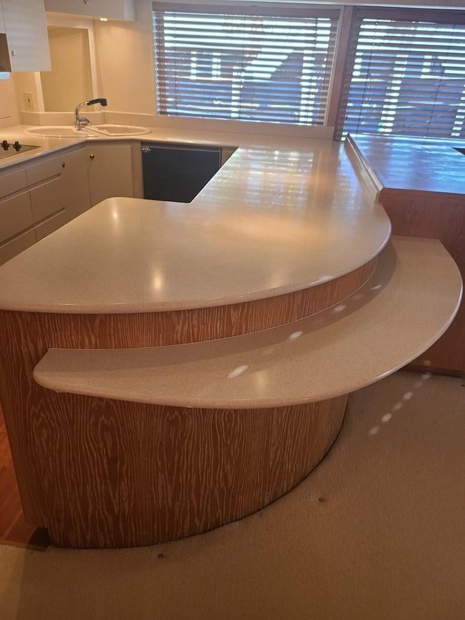 a large kitchen with a large island aboard LADY JANE Yacht for Sale