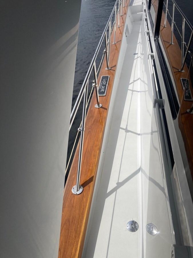 a white guitar leaning against a wall aboard LADY JANE Yacht for Sale