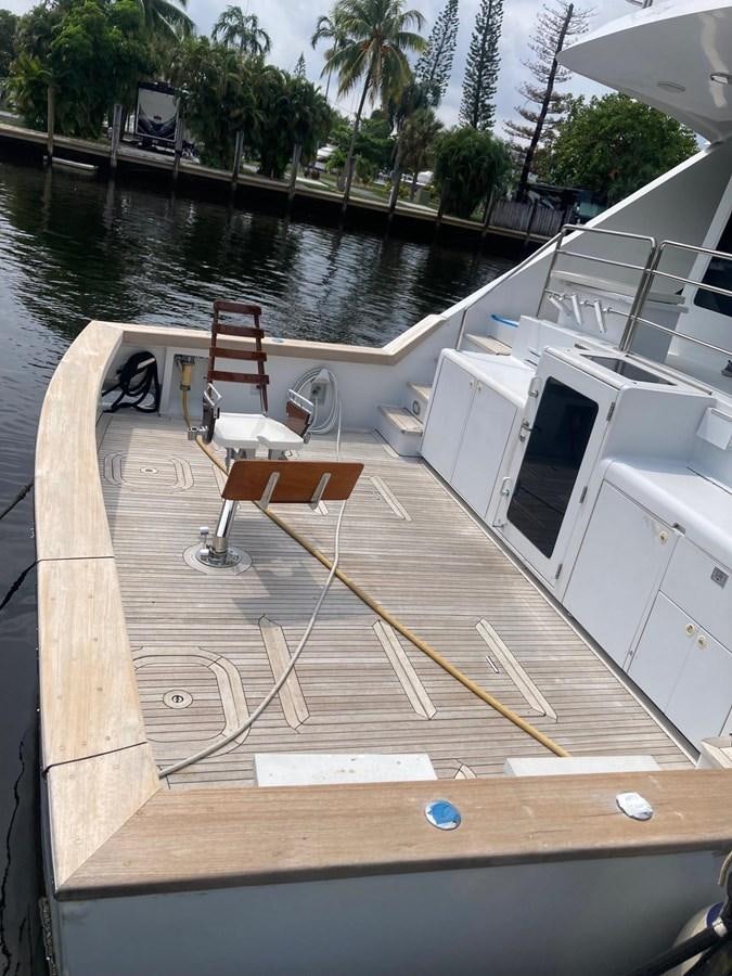 a deck with chairs and a pool aboard LADY JANE Yacht for Sale