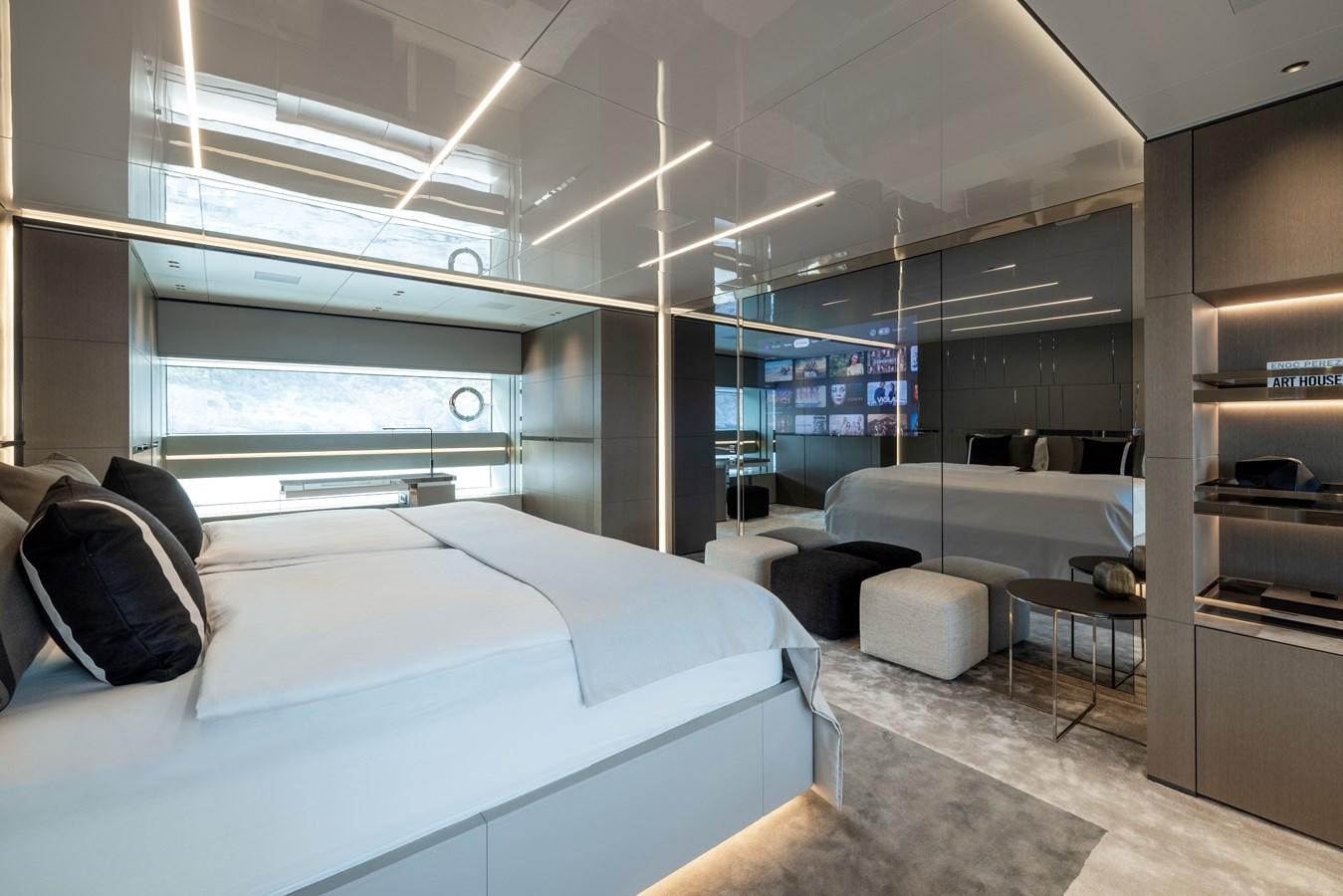 a room with a bed and a desk aboard NO STRESS Yacht for Sale