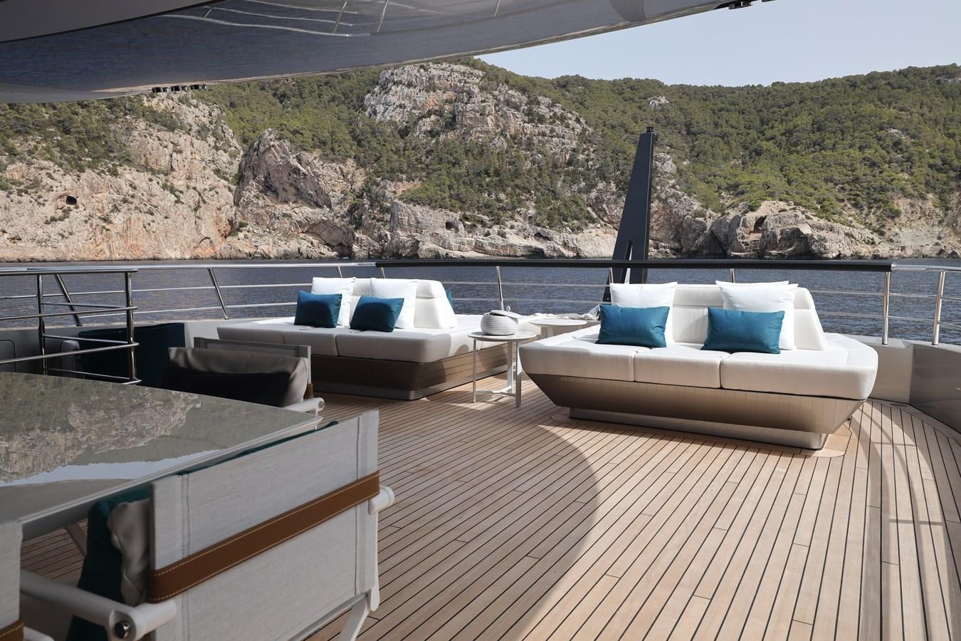 a deck with a view of a mountain and a large body of water aboard NO STRESS Yacht for Sale