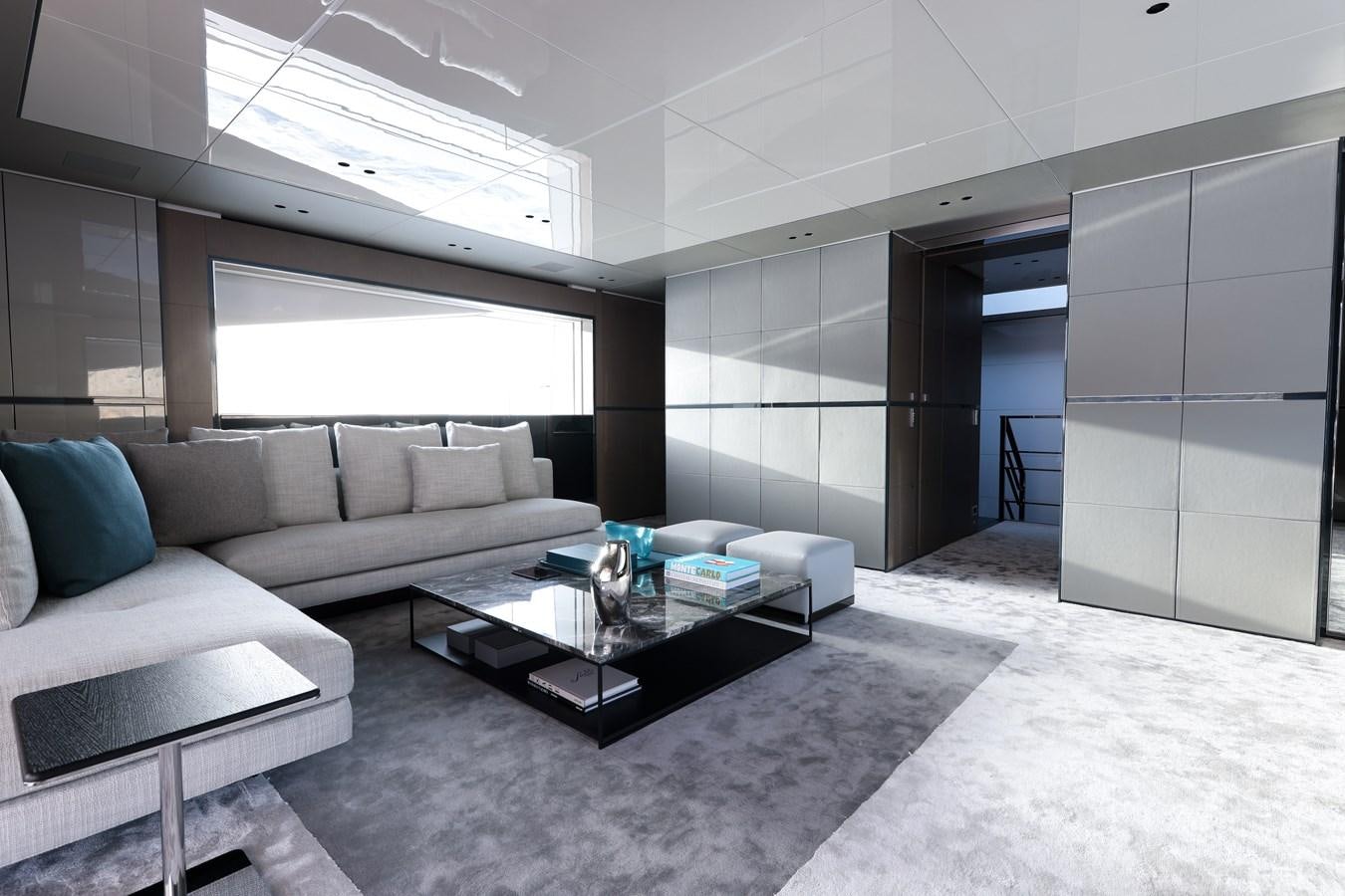 a room with a couch and a coffee table aboard NO STRESS Yacht for Sale