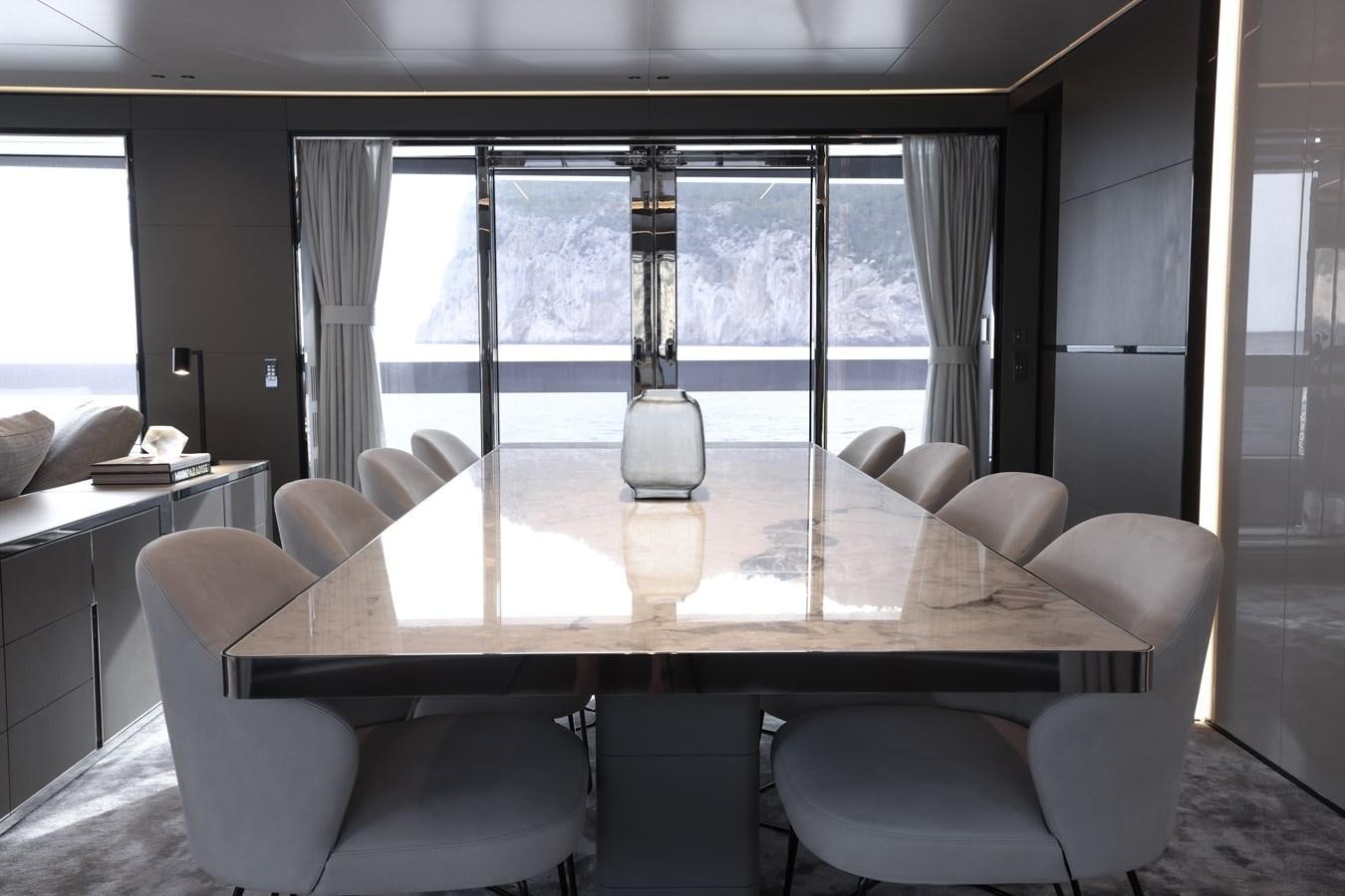 a room with a table and chairs aboard NO STRESS Yacht for Sale