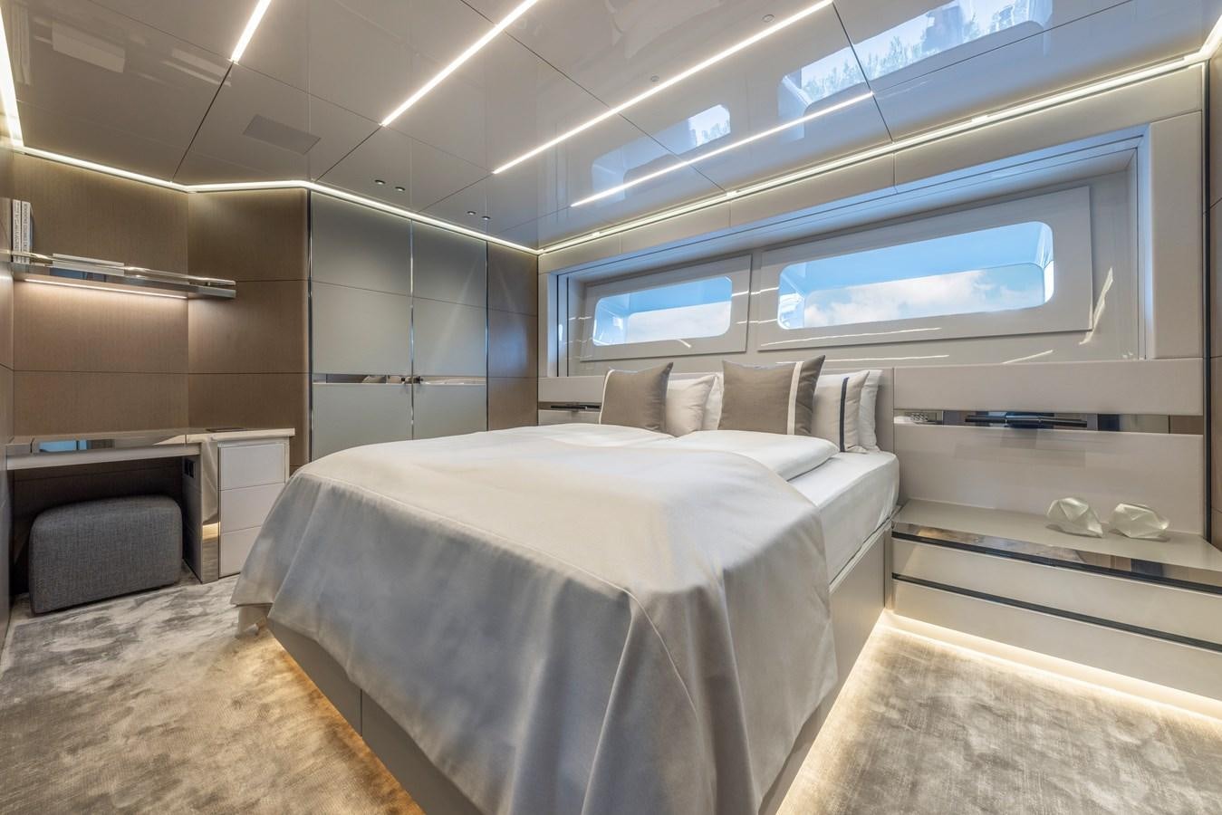 a room with a bed and a tv aboard NO STRESS Yacht for Sale