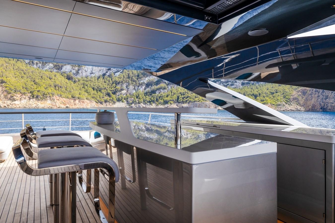 a deck with a view of the water and land aboard NO STRESS Yacht for Sale