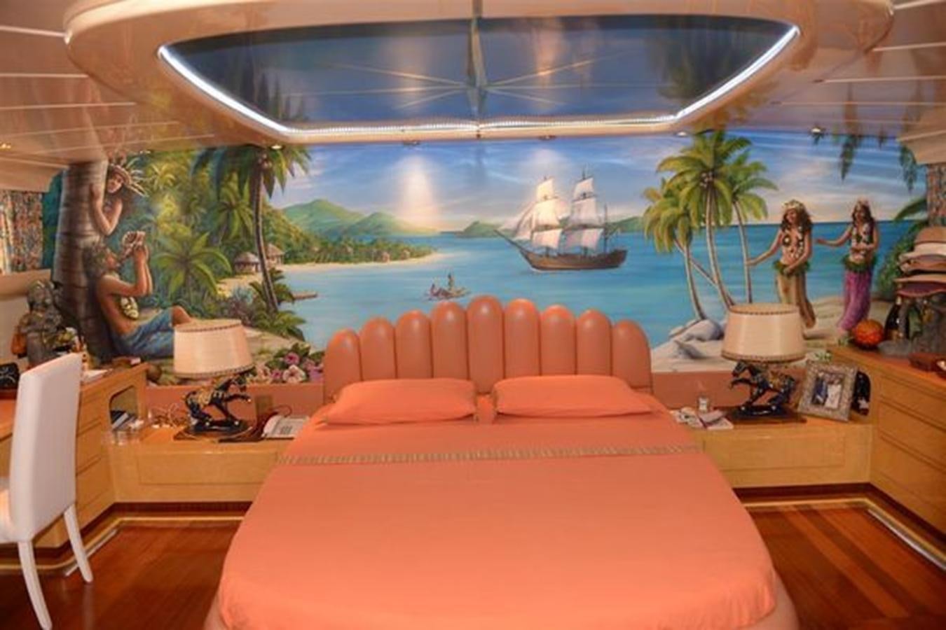 a room with a large bed and a large fish tank aboard MISTER P Yacht for Sale