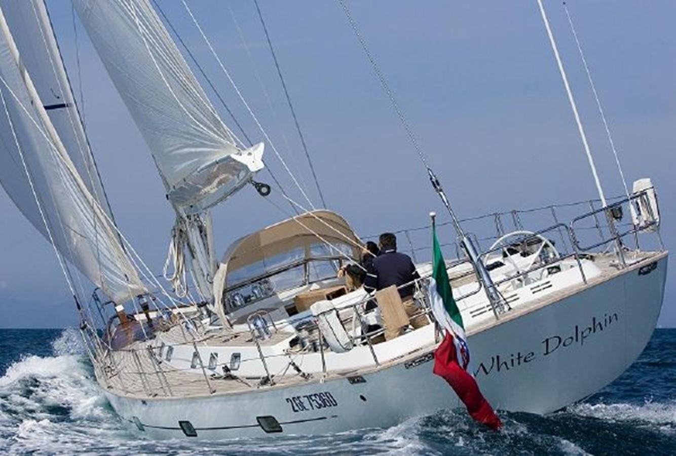 a couple of people on a sailboat aboard WHITE DOLPHIN Yacht for Sale