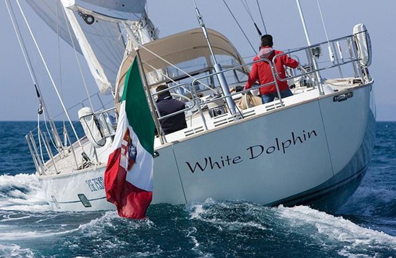 a man sailing on a boat aboard WHITE DOLPHIN Yacht for Sale