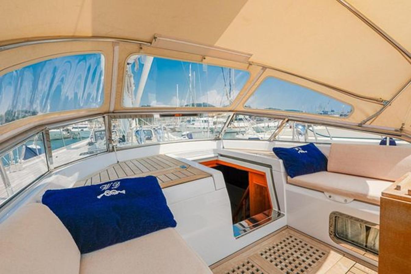 a room with a bed and a television aboard WHITE DOLPHIN Yacht for Sale