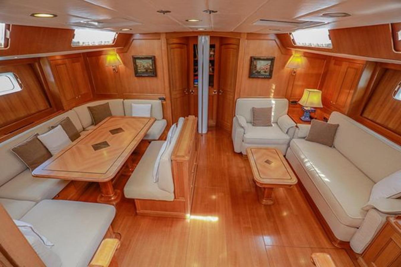 a living room with a wood floor aboard WHITE DOLPHIN Yacht for Sale