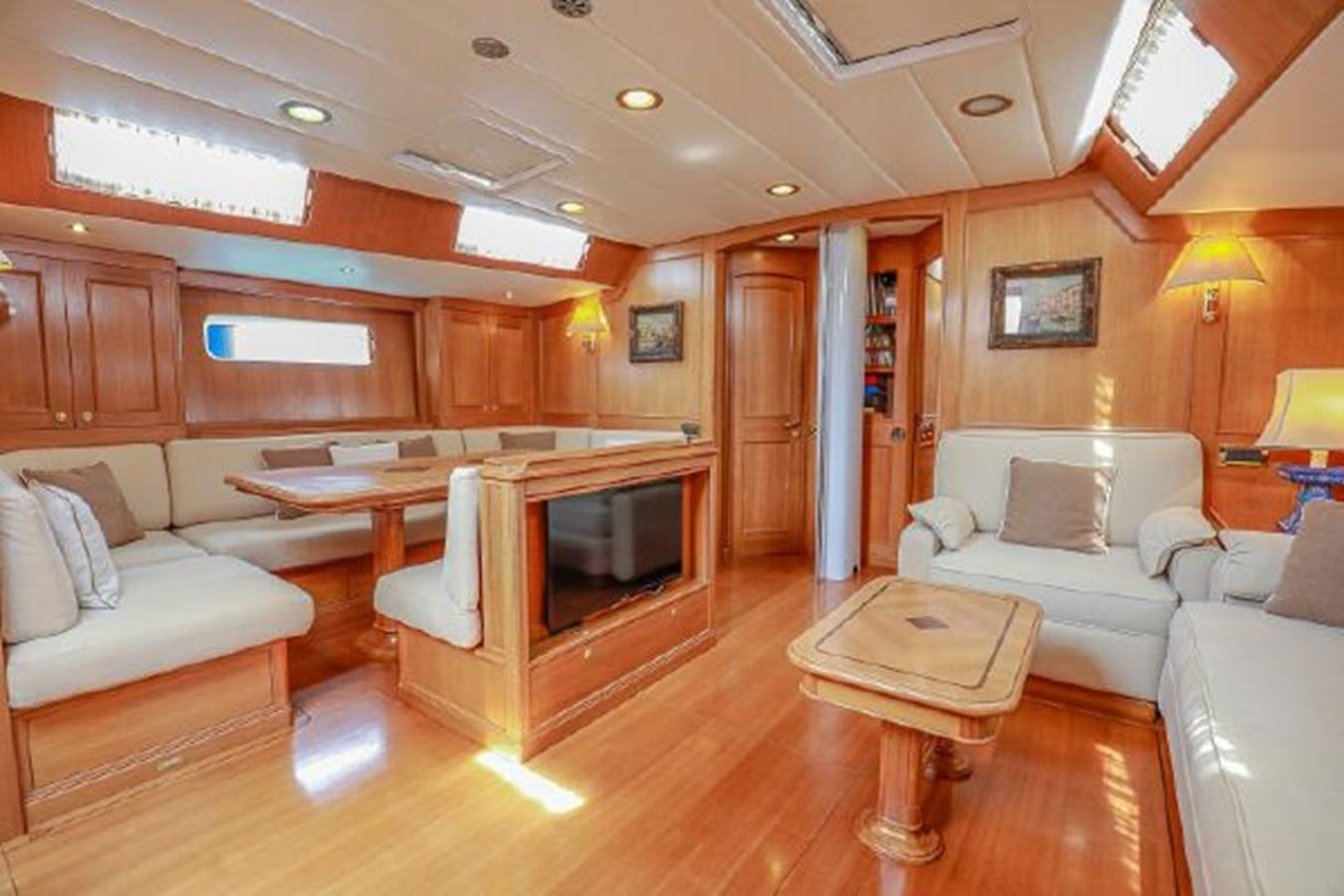 a living room with a fireplace aboard WHITE DOLPHIN Yacht for Sale