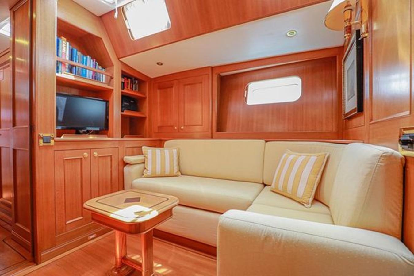 a living room with a couch and a coffee table aboard WHITE DOLPHIN Yacht for Sale