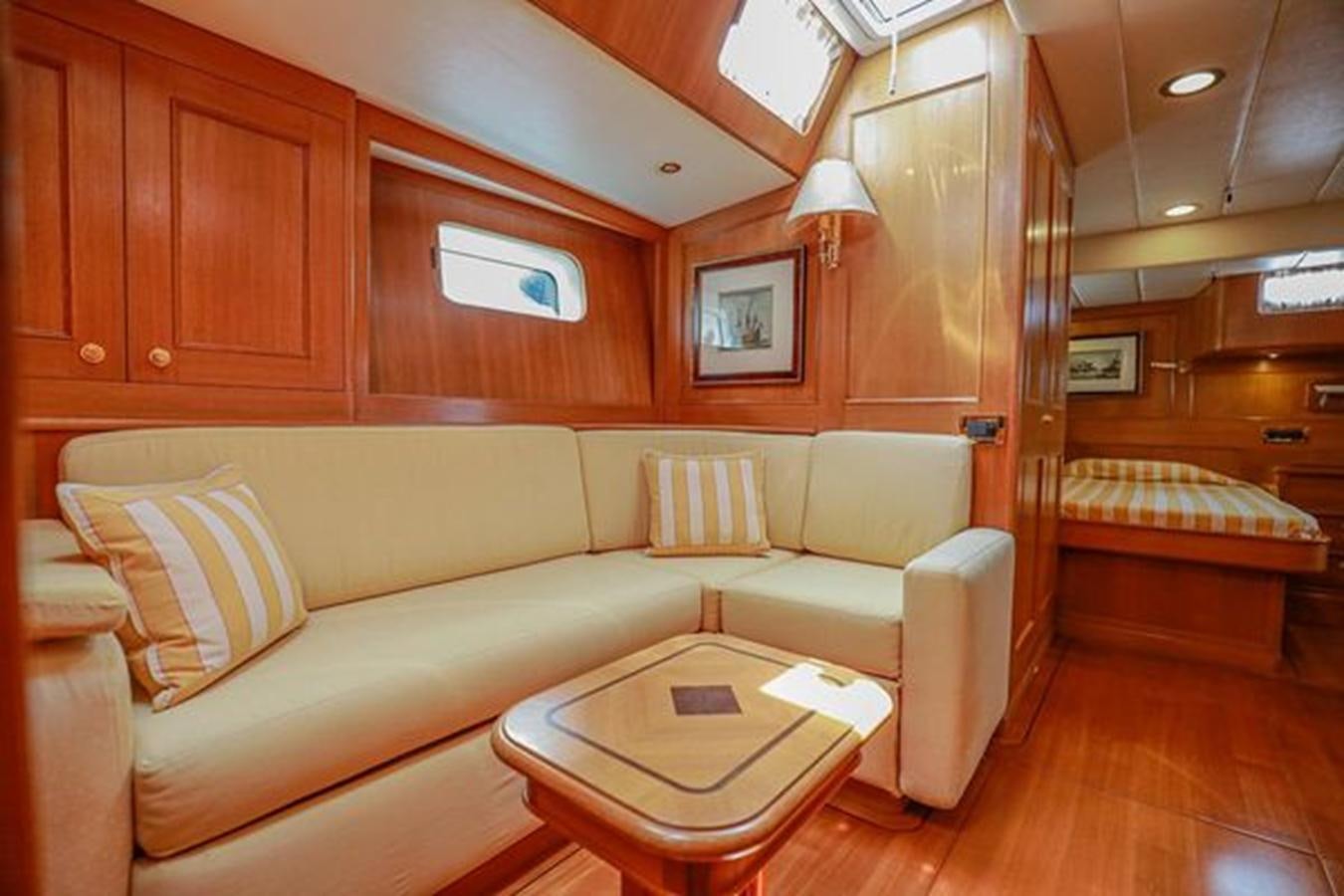 a living room with a couch and a table aboard WHITE DOLPHIN Yacht for Sale