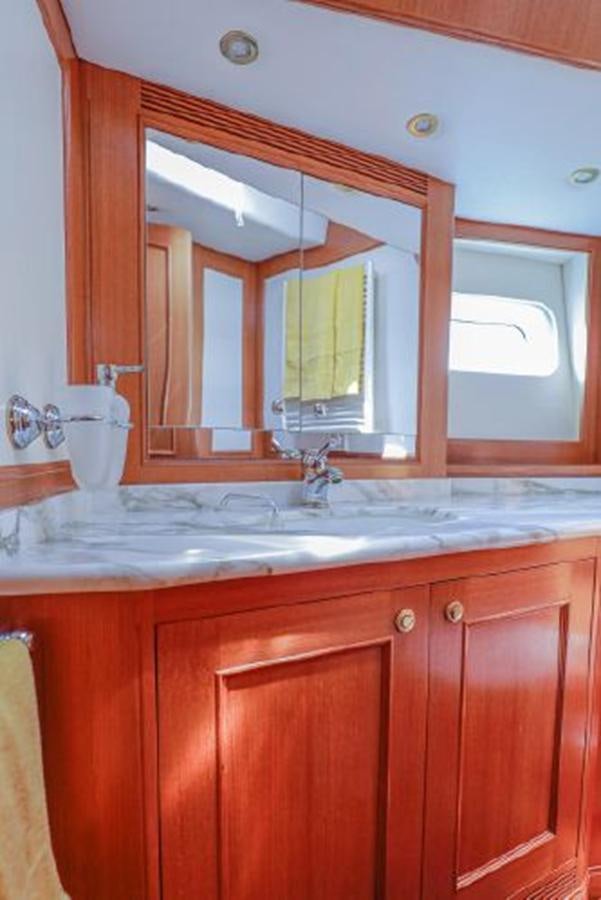 a bathroom with a large mirror aboard WHITE DOLPHIN Yacht for Sale