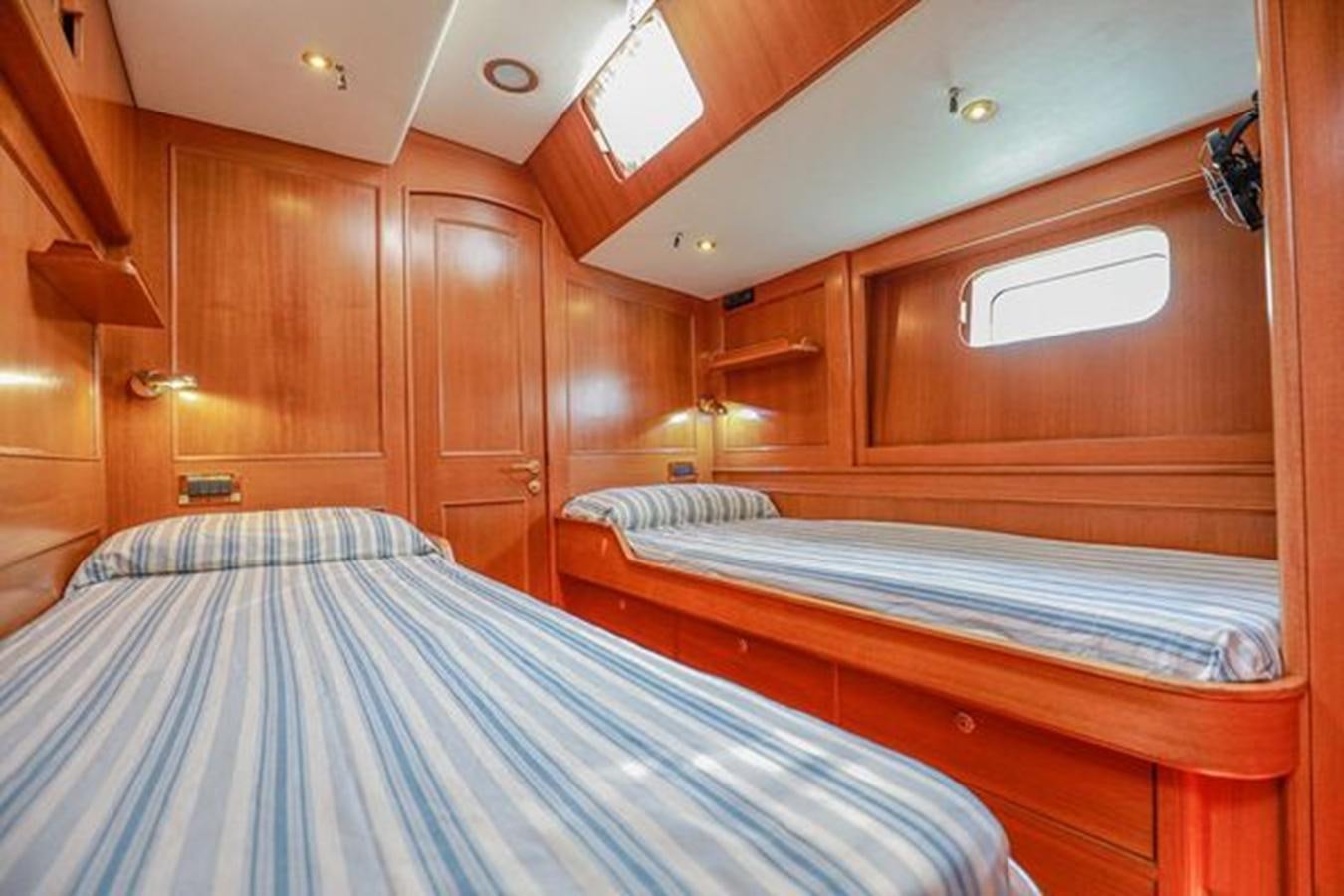 a room with wooden cabinets aboard WHITE DOLPHIN Yacht for Sale
