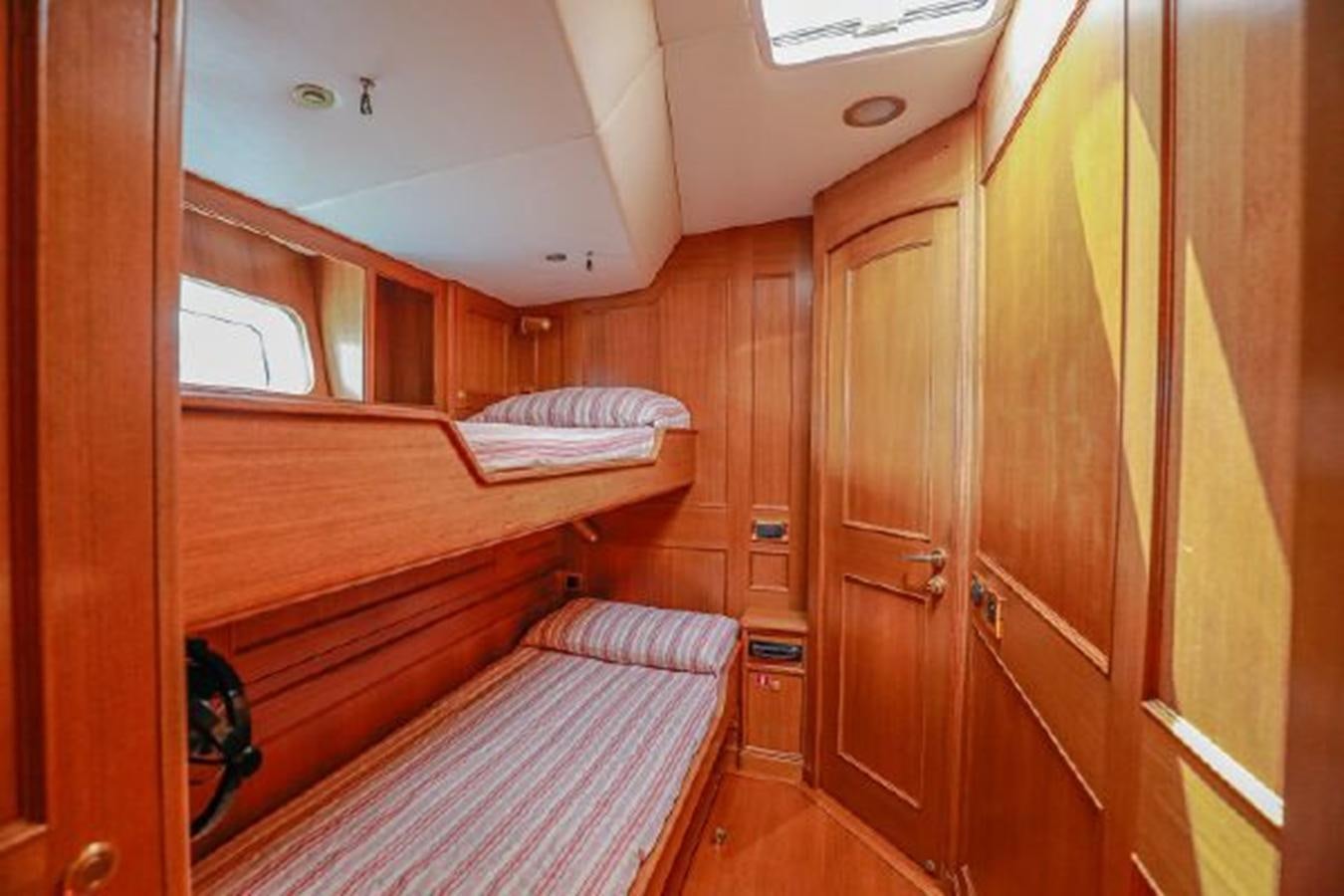 a room with wooden cabinets aboard WHITE DOLPHIN Yacht for Sale