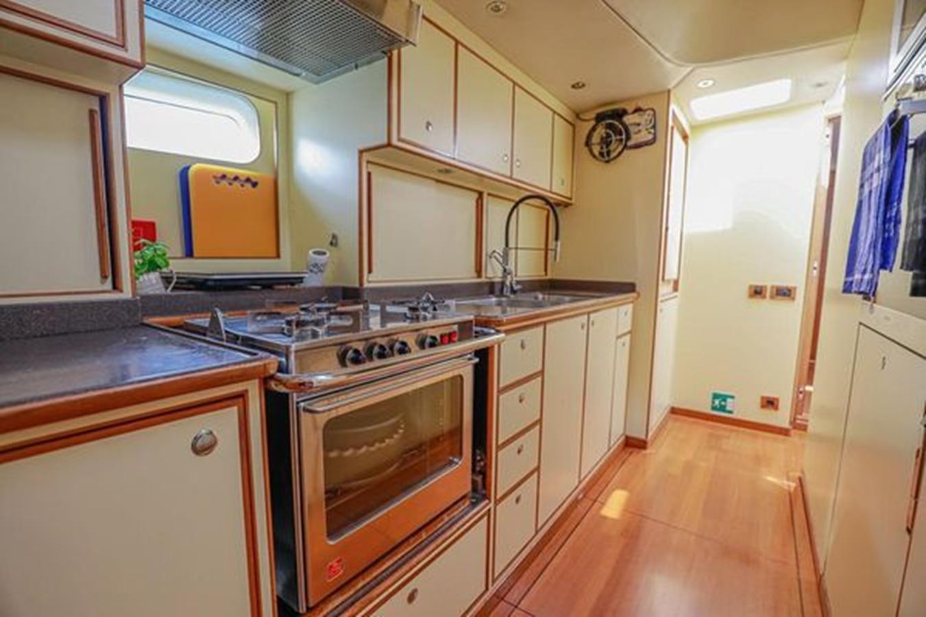 a kitchen with a stove and cabinets aboard WHITE DOLPHIN Yacht for Sale