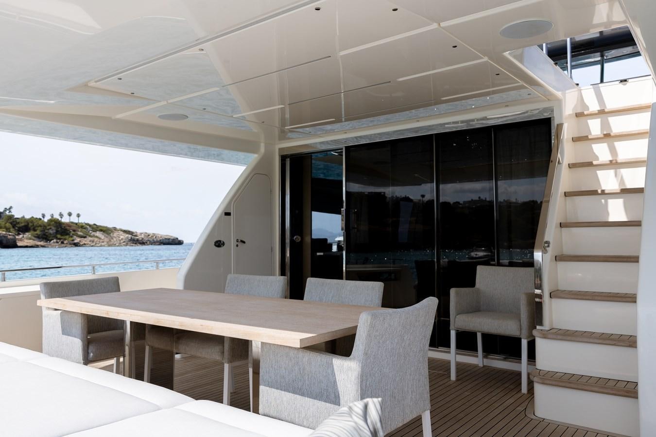 a room with a table chairs and a large window aboard LEWENSLUST Yacht for Sale