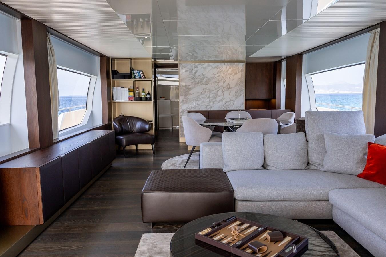 a living room with a couch and a table aboard LEWENSLUST Yacht for Sale