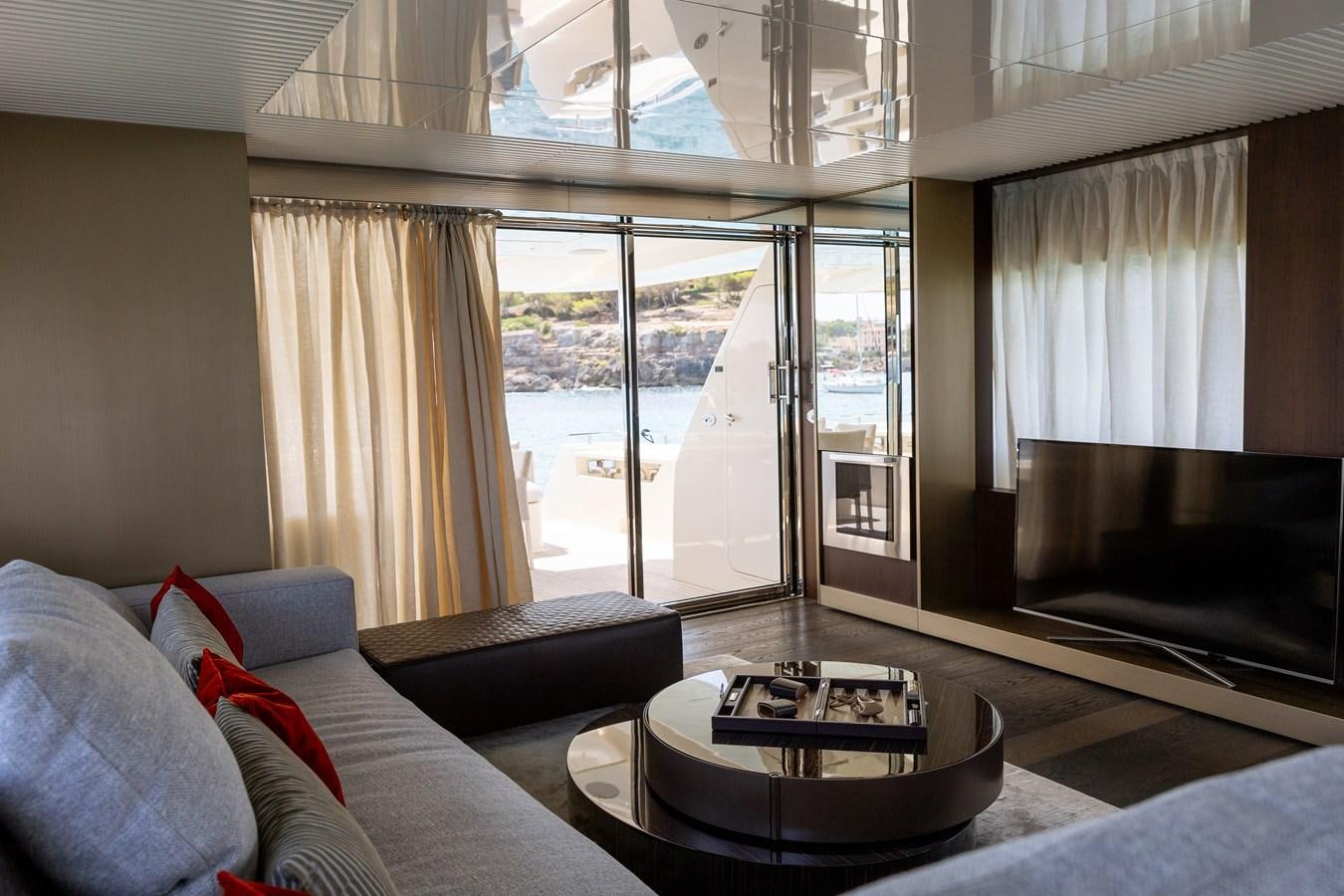 a living room with a couch and a tv aboard LEWENSLUST Yacht for Sale