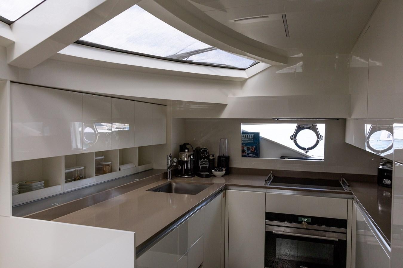 a kitchen with a sink and a microwave aboard LEWENSLUST Yacht for Sale