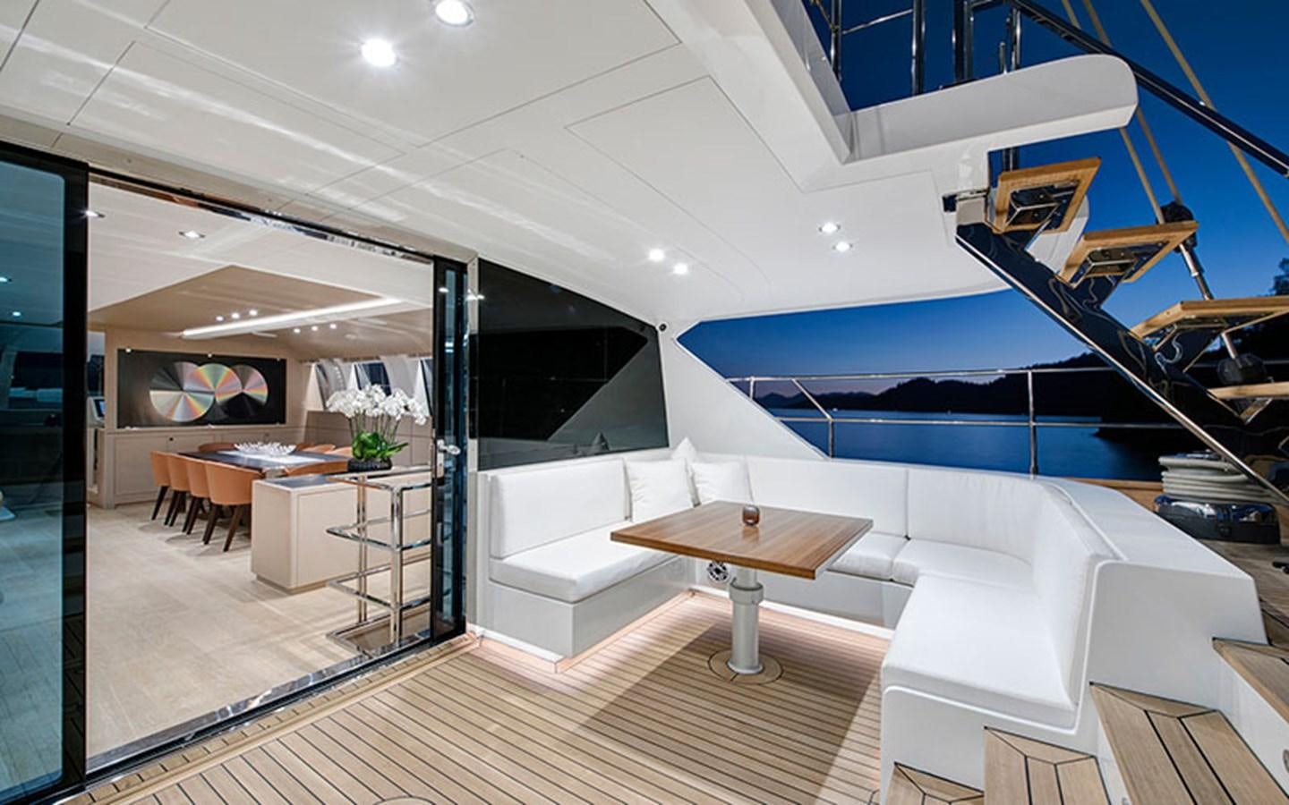 a room with a table and chairs aboard ATLANTIKA Yacht for Sale