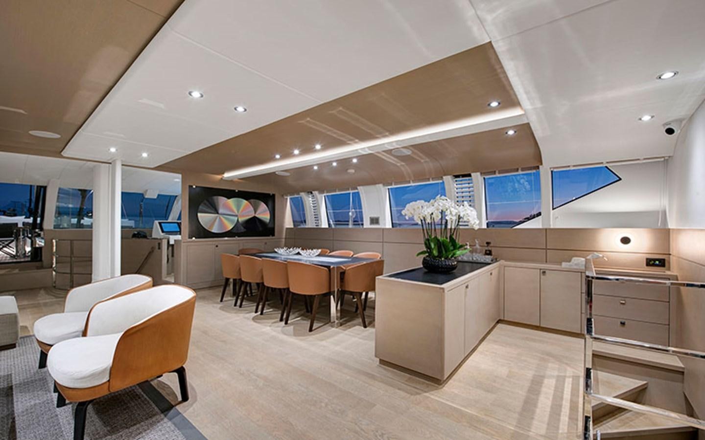 a room with tables and chairs aboard ATLANTIKA Yacht for Sale