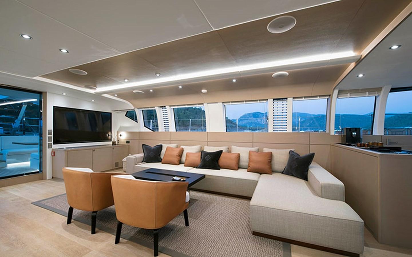 a living room with a couch and a tv aboard ATLANTIKA Yacht for Sale
