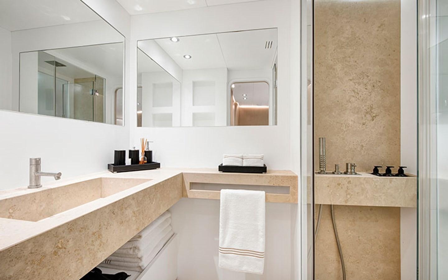 a bathroom with a large mirror aboard ATLANTIKA Yacht for Sale