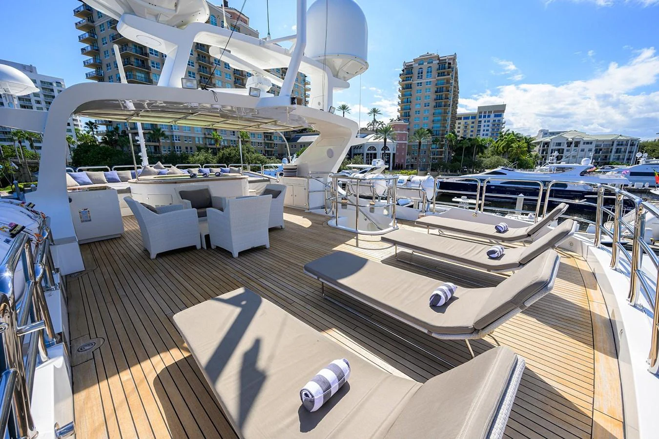 a deck with a large white yacht aboard ARTHUR’S WAY Yacht for Sale
