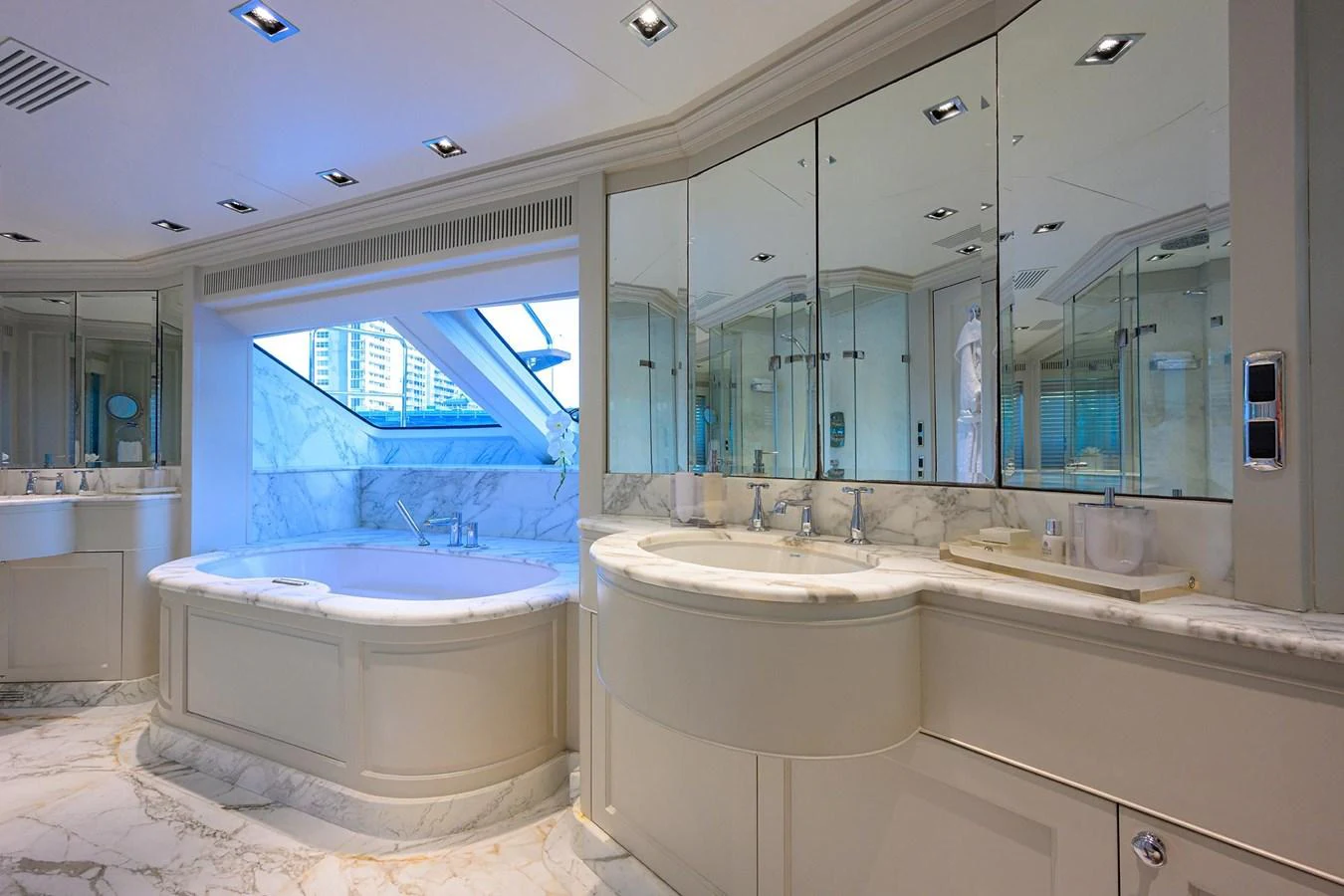 a bathroom with a large mirror aboard ARTHUR’S WAY Yacht for Sale
