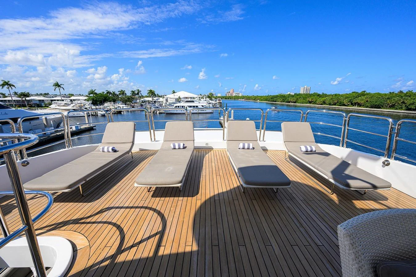 a deck with chairs and tables on it aboard ARTHUR’S WAY Yacht for Sale