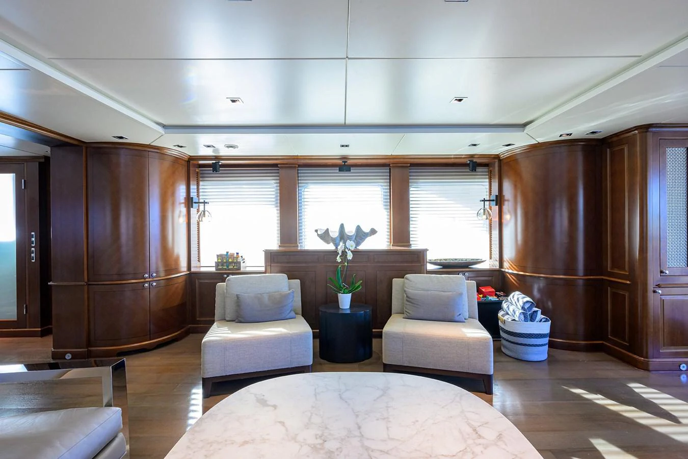a living room with a couch and a table aboard ARTHUR’S WAY Yacht for Sale