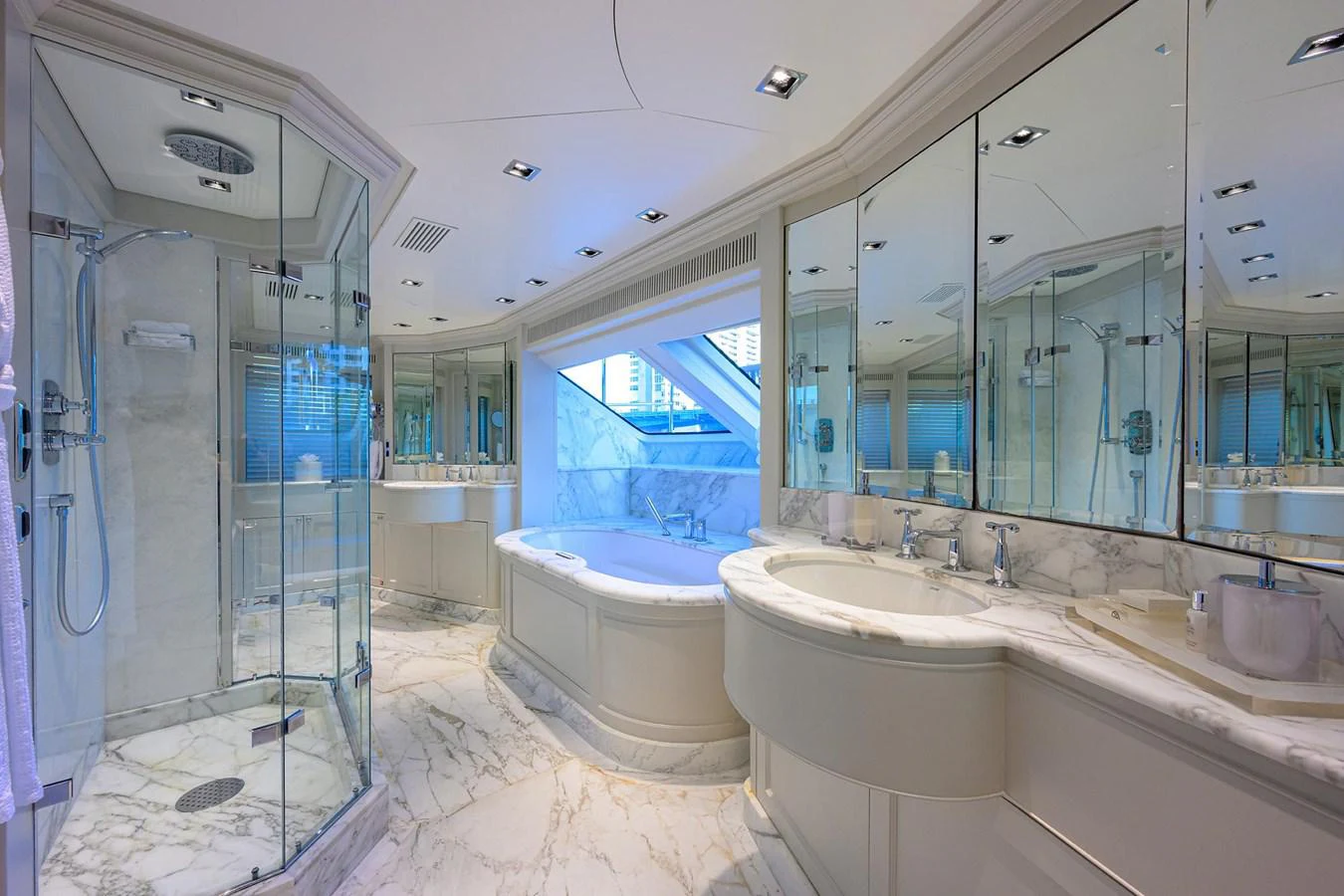 a bathroom with a bathtub and sink aboard ARTHUR’S WAY Yacht for Sale