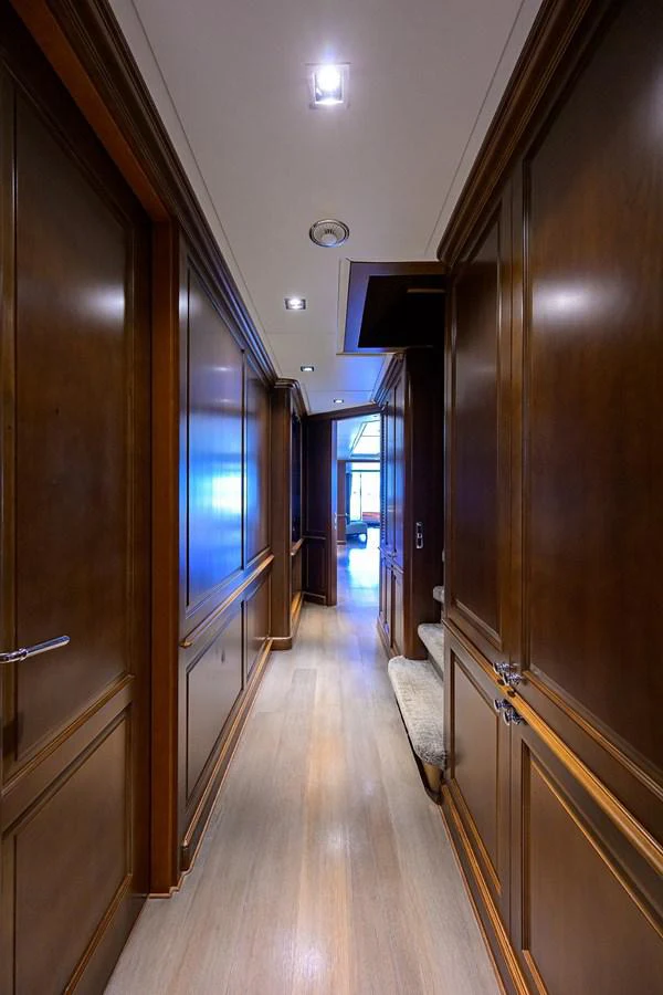 a hallway with wood cabinets aboard ARTHUR’S WAY Yacht for Sale