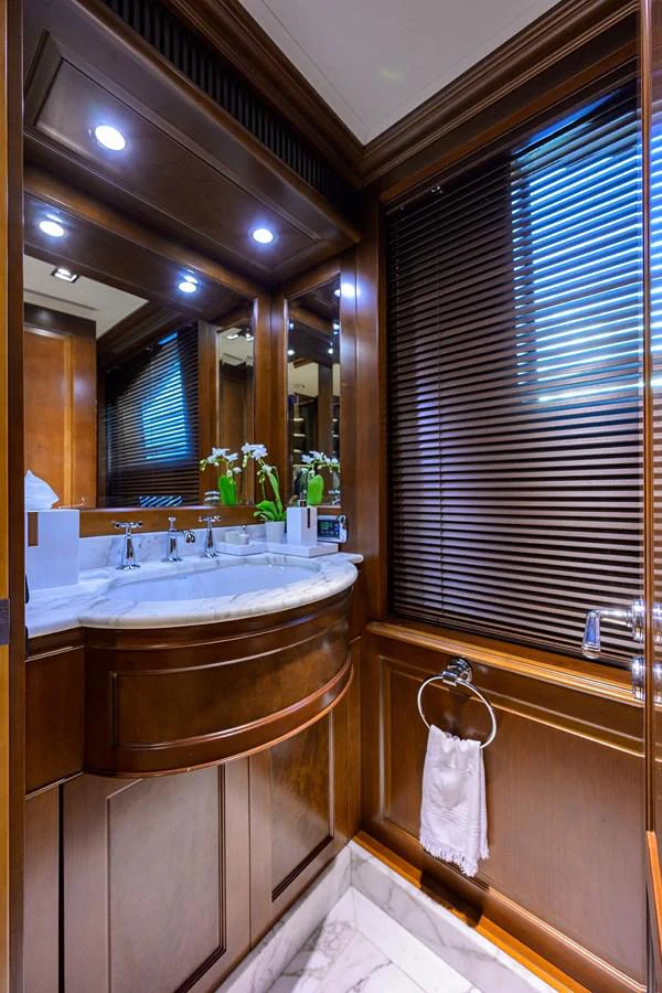 a bathroom with a tub sink and cabinets aboard ARTHUR’S WAY Yacht for Sale